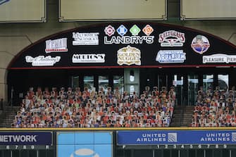 HOUSTON, TEXAS - JULY 24: Cutout pictures of fans are displayed in the Crawford Boxes before Opening Day game between Seattle Mariners and Houston Astros at Minute Maid Park on July 24, 2020 in Houston, Texas. The 2020 season had been postponed since March due to the COVID-19 pandemic. (Photo by Bob Levey/Getty Images)
