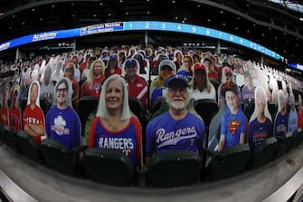 ARLINGTON, TEXAS - JULY 24:  Cardboard cut-out images of fans are seen in the stands before a game between the Colorado Rockies and the Texas Rangers on Opening Day at Globe Life Field on July 24, 2020 in Arlington, Texas.  The 2020 season had been postponed since March due to the COVID-19 pandemic. (Photo by Ronald Martinez/Getty Images)