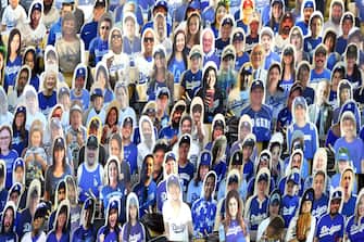 LOS ANGELES, CALIFORNIA - JULY 23: Cardboard cutouts of Los Angeles Dodgers fans are seen in seats before the Opening Day game between the San Francisco Giants and the Los Angeles Dodgers at Dodger Stadium on July 23, 2020 in Los Angeles, California. The 2020 season had been postponed since March due to the COVID-19 pandemic. (Photo by Harry How/Getty Images)