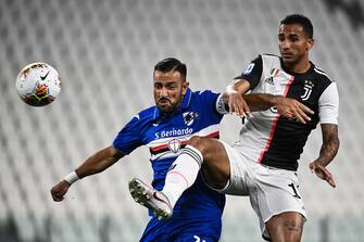 Sampdoria's Italian forward Fabio Quagliarella (L) fights for the ball with Juventus' Brazilian defender Danilo during the Italian Serie A football match Juventus vs Sampdoria played behind closed doors on July 26, 2020 at the Allianz Stadium in Turin. (Photo by MARCO BERTORELLO / AFP) (Photo by MARCO BERTORELLO/AFP via Getty Images)