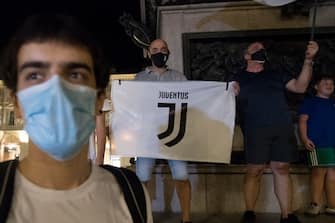 TURIN, ITALY - JULY 26: Juventus FC fans celebrate the team's Serie A victory over UC Sampdoria on July 26, 2020 in Turin, Italy. Fans gathered to celebrate the team's ninth consecutive Scudetto. (Photo by Stefano Guidi/Getty Images)
