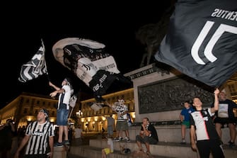 TURIN, ITALY - JULY 26: Juventus FC fans celebrate the team's Serie A victory over UC Sampdoria on July 26, 2020 in Turin, Italy. Fans gathered to celebrate the team's ninth consecutive Scudetto. (Photo by Stefano Guidi/Getty Images)