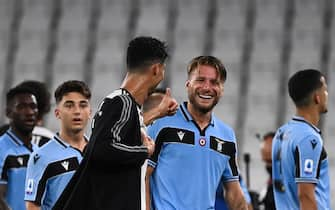 Juventus' Portuguese forward Cristiano Ronaldo (C) congratulates Lazio's Italian forward Ciro Immobile (R) at the end of the Italian Serie A football match between Juventus and Lazio, on July 20, 2020 at the Allianz stadium, in Turin, northern Italy. (Photo by Marco BERTORELLO / AFP) (Photo by MARCO BERTORELLO/AFP via Getty Images)