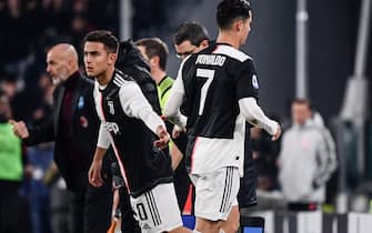 1181458920 Juventus' Portuguese forward Cristiano Ronaldo (R) leaves the pitch after being substituted by Juventus' Argentine forward Paulo Dybala (L) during the Italian Serie A football match Juventus vs AC Milan on November 10, 2019 at the Juventus Allianz stadium in Turin. (Photo by Marco Bertorello / AFP) (Photo by MARCO BERTORELLO/AFP via Getty Images)