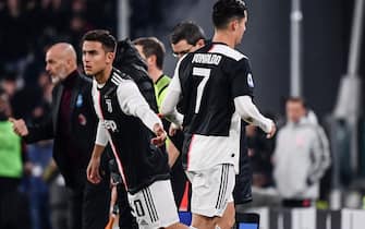 Juventus' Portuguese forward Cristiano Ronaldo (R) leaves the pitch after being substituted by Juventus' Argentine forward Paulo Dybala (L) during the Italian Serie A football match Juventus vs AC Milan on November 10, 2019 at the Juventus Allianz stadium in Turin. (Photo by Marco Bertorello / AFP) (Photo by MARCO BERTORELLO/AFP via Getty Images)