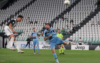 TURIN, ITALY - JULY 20: Portuguese striker Cristiano Ronaldo of Juventus heads the ball towards the SS Lazio goal during the Serie A match between Juventus and SS Lazio at Allianz Stadium on July 20, 2020 in Turin, Italy. (Photo by Jonathan Moscrop/Getty Images)