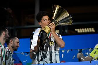 TURIN, ITALY - AUGUST 01: Cristiano Ronaldo of Juventus FC kisses the trophy after winning the Serie A Championship 2019-2020 between Juventus and AS Roma at Allianz Stadium on August 1, 2020 in Turin, Italy. (Photo by Stefano Guidi/Getty Images )