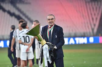 Juventus' head coach Maurizio Sarri jubilates with the cup during the celebrations for the Juventus' victory of the 9th consecutive Italian championship (scudetto) at Allianz Stadium in Turin, Italy, 01 August 2020. ANSA/ALESSANDRO DI MARCO