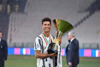 Juventus' player Cristiano Ronaldo jubilates with the cup during the celebrations for the Juventus' victory of the 9th consecutive Italian championship (scudetto) at Allianz Stadium in Turin, Italy, 01 August 2020. ANSA/ALESSANDRO DI MARCO