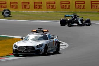 Mercedes' British driver Lewis Hamilton (R) drives behind the safety car during the Formula One British Grand Prix at the Silverstone motor racing circuit in Silverstone, central England on August 2, 2020. (Photo by Frank Augstein / POOL / AFP) (Photo by FRANK AUGSTEIN/POOL/AFP via Getty Images)