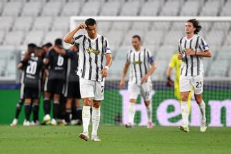 TURIN, ITALY - AUGUST 07: Cristiano Ronaldo of Juventus looks dejected after his team concede during the UEFA Champions League round of 16 second leg match between Juventus and Olympique Lyon at Allianz Stadium on August 07, 2020 in Turin, Italy. (Photo by Valerio Pennicino/Getty Images)