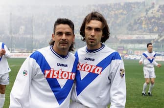 1217217041 UNSPECIFIED, ITALY: 2000-01 Roberto Baggio and Andrea Pirlo of Brescia Calcio pose for photo during the Serie A match between ACF Fiorentina and Brescia Calcio at Stadio Artemio Franchi in Florence , Italy. (Photo by Alessandro Sabattini/Getty Images)