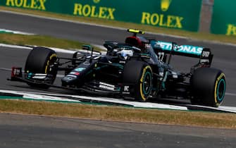 Mercedes' Finnish driver Valtteri Bottas steers his car during the qualifying session of the F1 70th Anniversary Grand Prix at Silverstone on August 8, 2020 in Northampton. - This weekend's race will commemorate the 70th anniversary of the inaugural world championship race, held at Silverstone in 1950. (Photo by Frank Augstein / POOL / AFP) (Photo by FRANK AUGSTEIN/POOL/AFP via Getty Images)