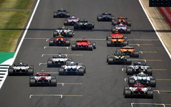 The cars leave the starting grid at the beginning of the race during the F1 70th Anniversary Grand Prix at Silverstone on August 9, 2020 in Northampton. - The race commemorates the 70th anniversary of the inaugural world championship race, held at Silverstone in 1950. (Photo by Bryn Lennon / POOL / AFP) (Photo by BRYN LENNON/POOL/AFP via Getty Images)