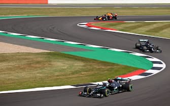 Mercedes' Finnish driver Valtteri Bottas (bottom) leads Mercedes' British driver Lewis Hamilton (R) during the F1 70th Anniversary Grand Prix at Silverstone on August 9, 2020 in Northampton. - The race commemorates the 70th anniversary of the inaugural world championship race, held at Silverstone in 1950. (Photo by Bryn Lennon / POOL / AFP) (Photo by BRYN LENNON/POOL/AFP via Getty Images)