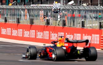 Red Bull's Dutch driver Max Verstappen drives through the final corner to take the chequered flag during the F1 70th Anniversary Grand Prix at Silverstone on August 9, 2020 in Northampton. - The race commemorates the 70th anniversary of the inaugural world championship race, held at Silverstone in 1950. (Photo by ANDREW BOYERS / POOL / AFP) (Photo by ANDREW BOYERS/POOL/AFP via Getty Images)