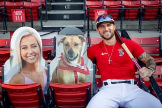 BOSTON, MA - AUGUST 8: Michael Chavis #23 of the Boston Red Sox poses with cardboard cutouts of his family members before a game against the Toronto Blue Jays on August 8, 2020 at Fenway Park in Boston, Massachusetts. (Photo by Billie Weiss/Boston Red Sox/Getty Images)