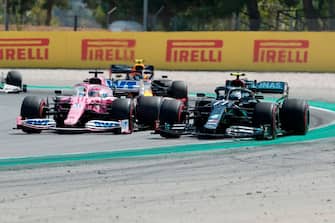 Racing Point's Mexican driver Sergio Perez (L) and Mercedes' Finnish driver Valtteri Bottas drive at the Circuit de Catalunya in Montmelo near Barcelona on August 16, 2020, during the Spanish Formula One Grand Prix. (Photo by ALBERT GEA / POOL / AFP) (Photo by ALBERT GEA/POOL/AFP via Getty Images)