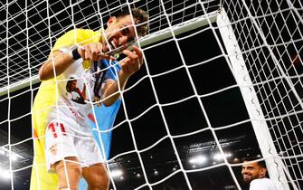 epa08617510 Sevilla's Munir cuts the goal net after the UEFA Europa League final match between Sevilla FC and Inter Milan in Cologne, Germany, 21 August 2020. Sevilla won 3-2.  EPA/Wolfgang Rattay / POOL