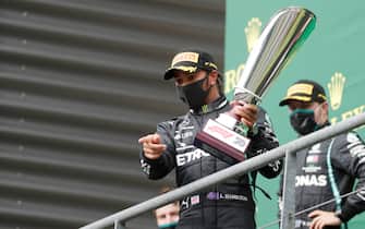 SPA, BELGIUM - AUGUST 30: Race winner Lewis Hamilton of Great Britain and Mercedes GP celebrates on the podium during the F1 Grand Prix of Belgium at Circuit de Spa-Francorchamps on August 30, 2020 in Spa, Belgium. (Photo by Stephanie Lecocq/Pool via Getty Images)