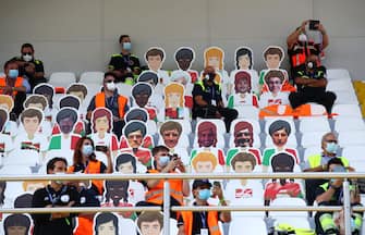 MONZA, ITALY - SEPTEMBER 06: Marshalls are seen in the stands with cardboard cut outs of fans prior to the F1 Grand Prix of Italy at Autodromo di Monza on September 06, 2020 in Monza, Italy. (Photo by Mark Thompson/Getty Images)