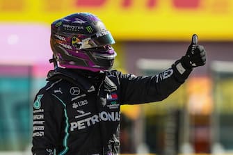 Mercedes' British driver Lewis Hamilton celebrates winning the pole position after the qualifying session at the Mugello circuit ahead of the Tuscany Formula One Grand Prix in Scarperia e San Piero on September 12, 2020. (Photo by Bryn Lennon / POOL / AFP) (Photo by BRYN LENNON/POOL/AFP via Getty Images)