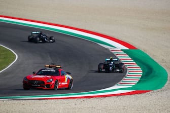 Mercedes' British driver Lewis Hamilton (back) and Mercedes' Finnish driver Valtteri Bottas (R) drive behind the safety car during the Tuscany Formula One Grand Prix at the Mugello circuit in Scarperia e San Piero on September 13, 2020. (Photo by Bryn Lennon / POOL / AFP) (Photo by BRYN LENNON/POOL/AFP via Getty Images)