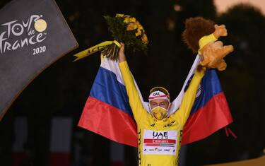 Team UAE Emirates rider Slovenia's Tadej Pogacar wearing the overall leader's yellow jersey celebrates on the podium after winning the 107th edition of the Tour de France cycling race, after the 21st and last stage of 122 km between Mantes-la-Jolie and Champs Elysees Paris, on September 20, 2020. (Photo by Marco Bertorello / AFP) (Photo by MARCO BERTORELLO/AFP via Getty Images)