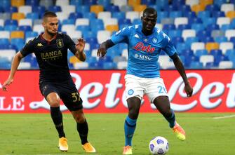 NAPLES, ITALY - SEPTEMBER 27: Kalidou Koulibaly of SSC Napoli competes for the ball with Mario Pjaca of Genoa CFC during the Serie A match between SSC Napoli and Genoa CFC at Stadio San Paolo on September 27, 2020 in Naples, Italy. (Photo by MB Media/Getty Images)