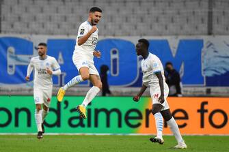 Marseille's French midfielder Morgan Sanson (C) celebrates after scoring a goal during the French L1 football match between Olympique de Marseille (OM) and FC Metz at the Orange Velodrome stadium in Marseille, Southern France on September 26, 2020. (Photo by Sylvain THOMAS / AFP) (Photo by SYLVAIN THOMAS/AFP via Getty Images)