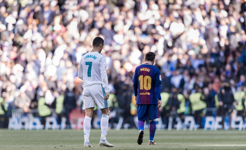 899658608 MADRID, SPAIN - DECEMBER 23: Lionel Messi of FC Barcelona and Cristiano Ronaldo of Real Madrid walk off pitch during La Liga match between Real Madrid and FC Barcelona at Santiago Bernabeu stadium on December 23, 2017 in Madrid, Spain. (Photo by Power Sport Images/Getty Images)