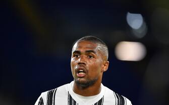 Juventus' Brazilian forward Douglas Costa reacts during the Italian Serie A football match Roma vs Juventus on September 27, 2020 at the Olympic stadium in Rome. (Photo by Tiziana FABI / AFP) (Photo by TIZIANA FABI/AFP via Getty Images)
