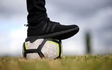 A photograph taken on April 30, 2020 shows a football ball on the field of the amateur football club "FC Parisis" at the club training centre, in Herblay, near Paris, on the 45th day of a lock-out in France aimed at stopping the spread of the COVID-19 pandemic, the new coronavirus. (Photo by FRANCK FIFE / AFP) (Photo by FRANCK FIFE/AFP via Getty Images)