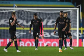 1228872284 LEEDS, ENGLAND - OCTOBER 03: Dejected players of Manchester City react after conceding during the Premier League match between Leeds United and Manchester City at Elland Road on October 3, 2020 in Leeds, United Kingdom. Sporting stadiums around the UK remain under strict restrictions due to the Coronavirus Pandemic as Government social distancing laws prohibit fans inside venues resulting in games being played behind closed doors. (Photo by Robbie Jay Barratt - AMA/Getty Images)