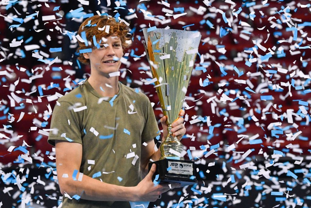 1229616471 Italian tennis player Jannik Sinner celebrates with the trophy during the podium ceremony after winning the final against his Canadian opponent at the ATP 250 Sofia Open tennis tournament in Sofia, on November 14, 2020. (Photo by NIKOLAY DOYCHINOV / AFP) (Photo by NIKOLAY DOYCHINOV/AFP via Getty Images)