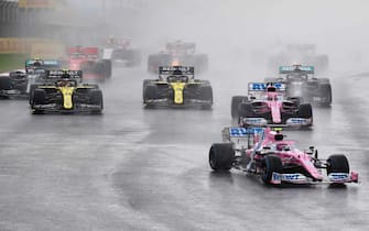 epa08821317 Canadian Formula One driver Lance Stroll of BWT Racing Point (front) leads the pack of cars during the 2020 Formula One Grand of Turkey at the Intercity Istanbul Park circuit, Istanbul, Turkey, 15 November 2020.  EPA/TOLGA BOZOGLU / POOL