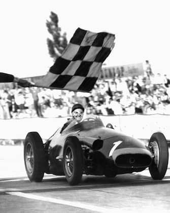 epa04877243 (FILE) A file picture dated 04 August 1957 shows Argentinian Formula One driver Juan Manuel Fangio crossing the finish line to become Formula One world champion for the fifth time after 1951 and 1954 to 1956 during the Formula One Grand Prix of Germany on the Nuerburg circuit near Nuerburg, Germany. The remains of Juan Manuel Fangio have been exhumed from his resting place in Argentina on the orders of a judge in order for DNA tests to settle a paternity claim.  EPA/ALBERT RIETHAUSEN B/W ONLY