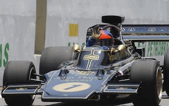 epa02434676 Brazilian Emerson Fittipaldi, two time Formula One champion (1972-1974), drives his single-seater model 72 from Lotus team at the Interlagos Raceway in Sao Paulo, Brazil, on 07 November 2010, before the begining of the Brazilian Formula 1 Grand Prix.  EPA/FERNANDO BIZERRA JR