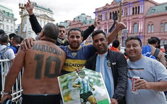 Fans wait to enter the Government House to pay tribute to late football legend Diego Armando Maradona in Buenos Aires, on November 26, 2020. - Diego Maradona's coffin arrived at the presidential palace in Buenos Aires for a period of lying in state, TV reports showed, following the death of the Argentine football legend aged 60 on November 25. Hundreds of people were already lining up to pay their respects to Maradona, who died while recovering from a brain operation, the images from sports channels TyC and ESPN showed. (Photo by ALEJANDRO PAGNI / AFP) (Photo by ALEJANDRO PAGNI/AFP via Getty Images)
