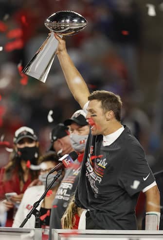 epa08995244 Tampa Bay Buccaneers quarterback Tom Brady celebrates with the Vince Lombardi Trophy after the Buccaneers deafeated the Kansas City Chiefs to win the National Football League Super Bowl LV at Raymond James Stadium in Tampa, Florida, USA, 07 February 2021.  EPA/CJ GUNTHER