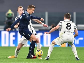 Juventus  Dejan kulusevski and Lazio s Lucas Leiva in action during the italian Serie A soccer match Juventus FC vs SS Lazio at the Allianz stadium in Turin, Italy, 6 March 2021 ANSA/ALESSANDRO DI MARCO