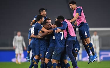 TURIN, ITALY - MARCH 09: Sergio Oliveira of Porto celebrates with team mates after scoring their side's second goal during the UEFA Champions League Round of 16 match between Juventus and FC Porto at Juventus Arena on March 09, 2021 in Turin, Italy. Sporting stadiums around Italy remain under strict restrictions due to the Coronavirus Pandemic as Government social distancing laws prohibit fans inside venues resulting in games being played behind closed doors. (Photo by Valerio Pennicino/Getty Images)