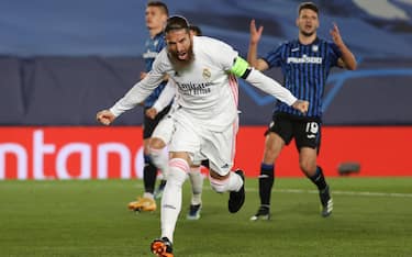epa09078793 Real Madrid's defender Sergio Ramos celebrates after scoring the 2-0 goal during the UEFA Champions League round of 16 second leg soccer match between Real Madrid and Atalanta held at Alfredo Di Stefano stadium, in Madrid, central Spain, 16 March 2021.  EPA/JuanJo Martin