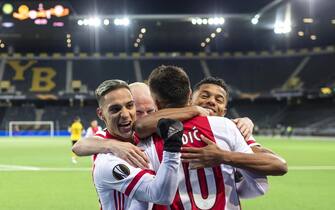epaselect epa09082981 Ajax's Dusan Tadic (2-R) celebrates with  teammates (L-R) Antony, Davy Klaassen, and David Neres after scoring the 2-0 lead from the penalty spot during the UEFA Europa League round of 16, second leg soccer match between BSC Young Boys and Ajax Amsterdam at the Wankdorf stadium in Bern, Switzerland, 18 March 2021.  EPA/ALESSANDRO DELLA VALLE