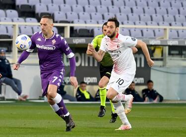 Fiorentina's midfielder Franck Ribery (L) vies for the ball with Milan's midfielder Hakan Calhanoglu (R) during the Italian Serie A soccer match between ACF Fiorentina and AC Milan at the Artemio Franchi stadium in Florence, Italy, 21 March 2021. ANSA/CLAUDIO GIOVANNINI