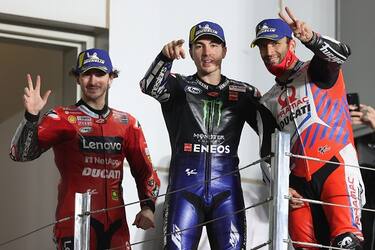 Monster Energy Yamaha MotoGP's Spanish rider Maverick Vinales (C), Pramac Racing's French rider Johann Zarco (R) and Ducati Lenovo Team's Italian rider Francesco Bagnaia celebrate the Moto GP Qatar Grand Prix at the Losail International Circuit, in the city of Lusail on March 28, 2021. - Yamaha's Vinales won the race, with Zarco and Bagnaia finishing second and third respectively. (Photo by KARIM JAAFAR / AFP) (Photo by KARIM JAAFAR/AFP via Getty Images)