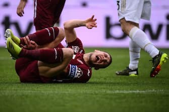 Torino's Italian forward Andrea Belotti reacts in pain after being tackled during the Italian Serie A football match Torino vs Juventus on April 03, 2021 at the Olympic stadium in Turin. (Photo by Marco BERTORELLO / AFP) (Photo by MARCO BERTORELLO/AFP via Getty Images)