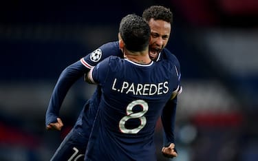 PARIS, FRANCE - APRIL 13: Neymar of Paris Saint-Germain and teammate Leandro Paredes celebrate their team's victory at full-time after the UEFA Champions League Quarter Final Second Leg match between Paris Saint-Germain and FC Bayern Munich at Parc des Princes on April 13, 2021 in Paris, France. Sporting stadiums around France remain under strict restrictions due to the Coronavirus Pandemic as Government social distancing laws prohibit fans inside venues resulting in games being played behind closed doors. (Photo by Alexander Scheuber - UEFA/UEFA via Getty Images)