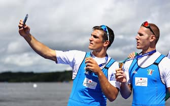GLASGOW, SCOTLAND - AUGUST 04: Filippo Mondelli of Italy takes a selfie with teammate Luca Rambaldi after they won gold in the Men's Quadruple Sculls during the rowing on Day Three of the European Championships Glasgow 2018 at Strathclyde Country Park on August 4, 2018 in Glasgow, Scotland.  (Photo by Dan Istitene/Getty Images)