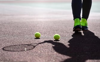 epa09105038 People play tennis at a public tennis court in London, Britain, 29 March 2021. The UK government is easing lockdown measures due to the coronavirus pandemic. Outdoor sport facilities including swimming pools, tennis courts and golf courses are reopening and organized outdoor sports can resume. Two households or groups of up to six people are now able to meet outside in England as the stay-at-home Covid restrictions order ends.  EPA/ANDY RAIN